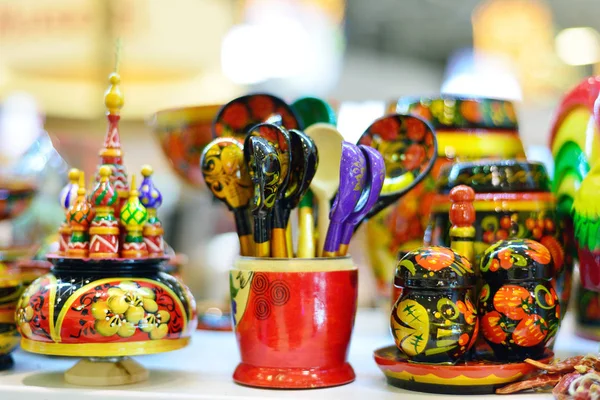 Russian traditional souvenirs, wooden spoons, figurines.