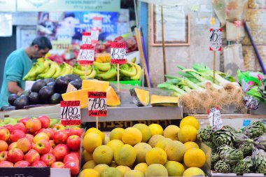 JERUSALEM, ISRAEL - APRIL 2017:  Fresh Exotic Fruits on the Eastern Market Stall in Israely Market Mahane Yehuda, Jerusalem clipart