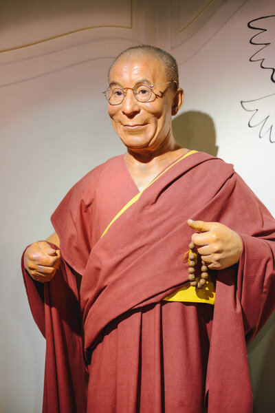 PRAGUE, CZECH REPUBLIC - MAY 2017: wax statue of the Dalai Lama monument in the wax statue museum in the Czech Republic in the capital Prague