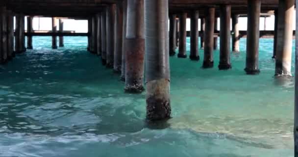 Waves Crashing Into Pier Supports — ストック動画