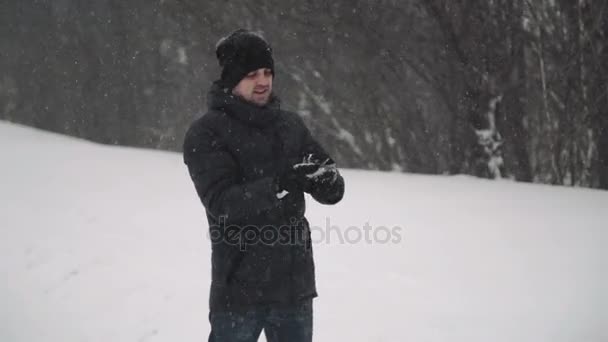 Portrait of a young handsome man with a beard. A bearded man in the winter woods. Healthy young bearded man in nature. — Stock Video