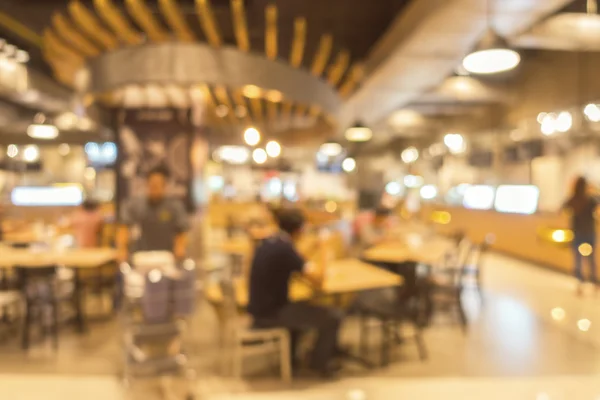 Food court center na cena borrão na loja de departamento . — Fotografia de Stock