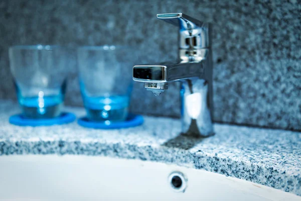 Faucet and water drop in bathroom. — Stock Photo, Image