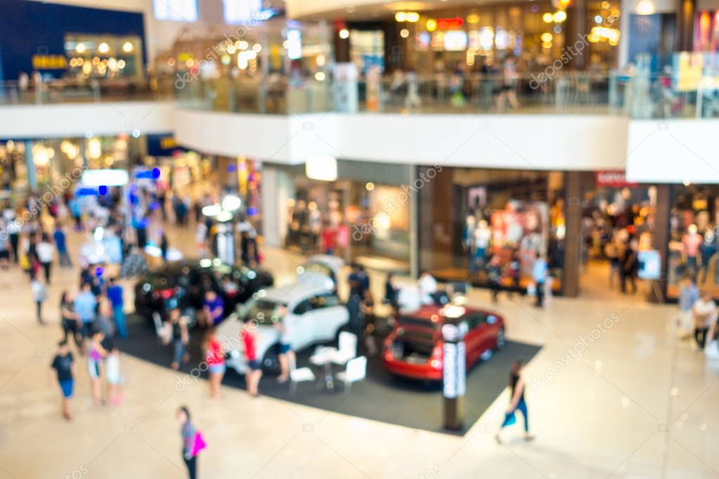 Abstract blurred motor show in department store