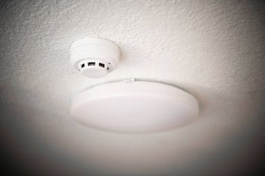 Smoke detector and fire protection system on ceiling clipart