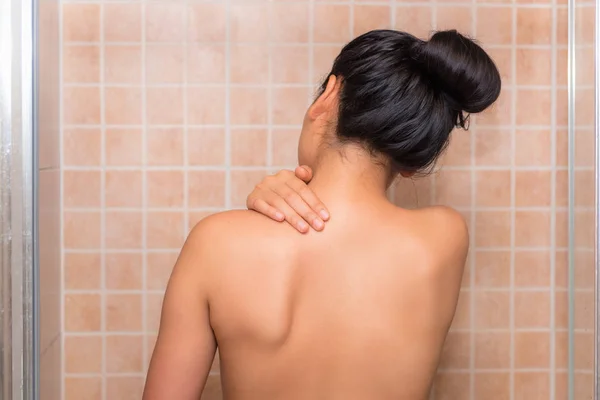 Woman massaging her neck and painful after too much work — Stock Photo, Image