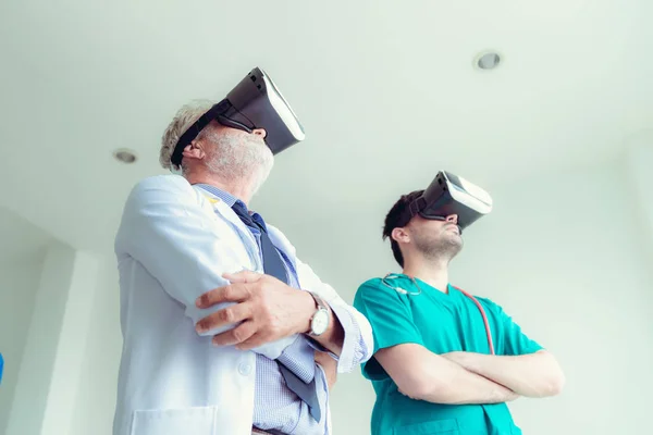 Portrait of doctor team are using virtual reality technology to examination physical body patient., Technology and occupational concept.