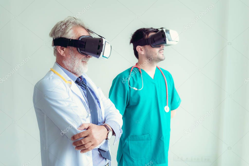 Portrait of doctor team are using virtual reality technology to examination physical body patient., Technology and occupational concept.