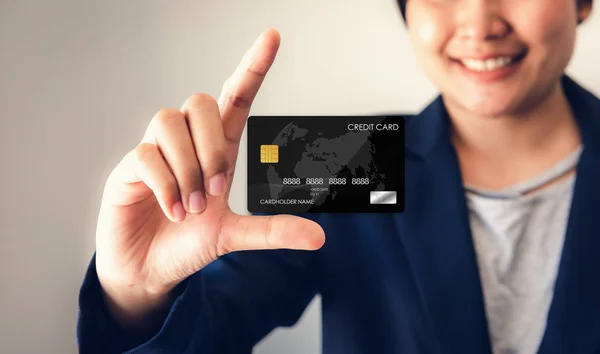 Technology Digital Connection and Business Credit Banking Concept, Business Woman is Using Credit Card on Interface Screen of Future Innovation System. Credit Shopping Online on Interactive Screen