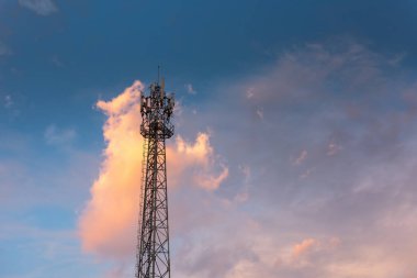 Communication Antenna Tower for Telecommunication Network Against Blue Sky Background on Sunrise. Technology Cellular and Transmission Connection of Telecom, Satellite Broadband Structure Station.