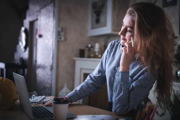 Work From Home Lifestyle and Business Online, Attractive Woman Hands is Calling on Mobile Phone While Working at Home. Business Freelance Person Using Computer Laptop at Her Home Workplace, New Normal