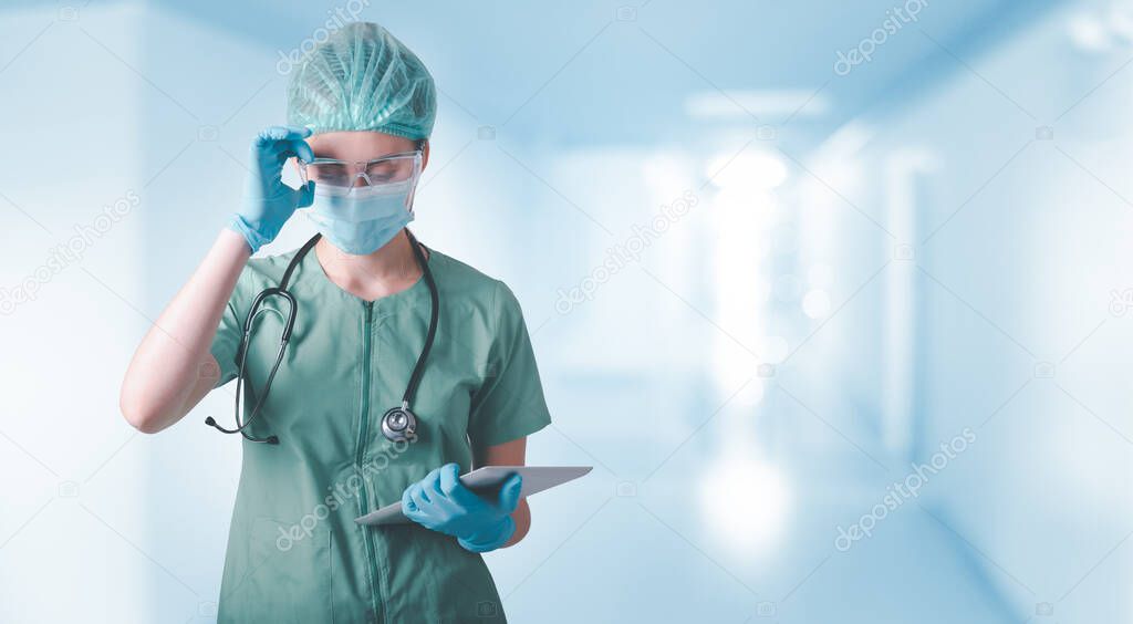Medical Surgical Doctor and Health Care, Portrait of Surgeon Doctor in PPE Equipment in Examination Room. Medicine Female Doctors Wearing Face Mask and Cap for Patients Surgery Work. Medic Hospital