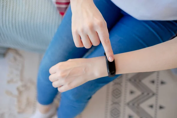 Smart watch on the wrist. Fitness bracelet on abstract bokeh background. Modern technologies health care. Horizontal view — 스톡 사진