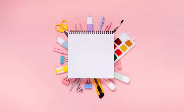 Back to school concept notepad, pencil case, stationery and school supplies. Top horizontal view copyspace pink background — Stock Photo, Image