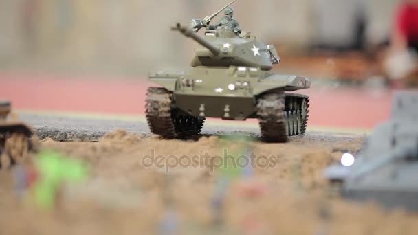 Close-up of toy tanks go and shoot — Stock Video