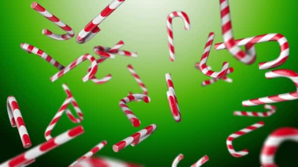 Christmas candy on a green background — Stock Video