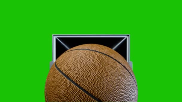 バスケットボールは緑の背景にスローモーションでバスケットを打つ — ストック動画