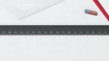 Red pencil draws a line along the ruler