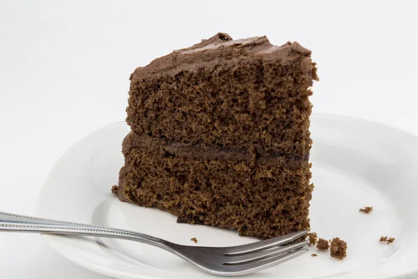 Slice of chocolate cake on white plate isolated — Stock Photo, Image