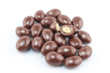 Chocolate covered nut balls in a group isolated on white background clipart