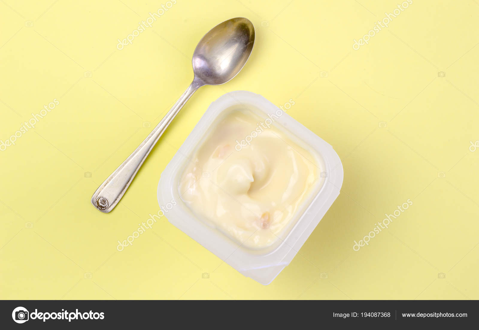 Download Yoghurt Cup Yellow Background Small Silver Spoon Yogurt Background Space Stock Photo C Toscaw 194087368 PSD Mockup Templates
