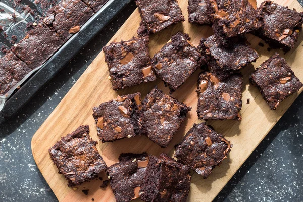 Chocolate brownie squares taken out of baking tin and place on w — Stock Photo, Image