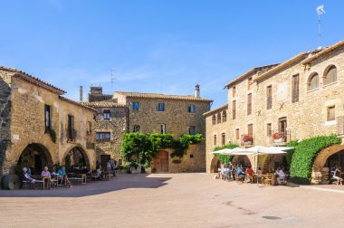 The main square in Monells, Spain clipart