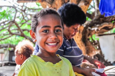 Child local village in Mana Island, Fiji clipart