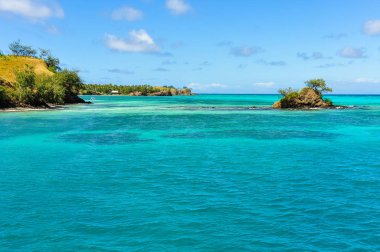 Small island near Nacula Island in Fiji clipart