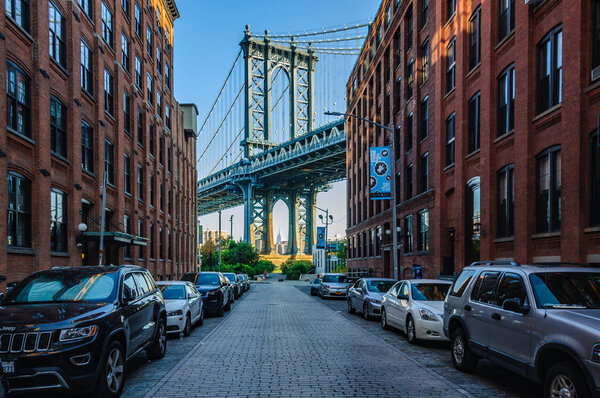 Famous view of Manhattan Bridge in Washington Street in Brooklyn, New York City, USA