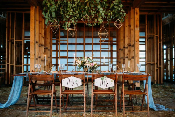 Wedding table decoration. Wooden arbor.