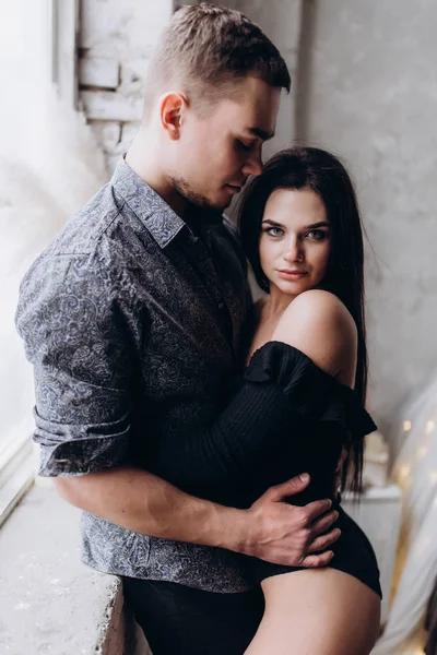 Guy Gently Hugs Girl Window — Stock Photo, Image