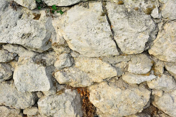 Stone wall. Foundation under the house — Stock Photo, Image