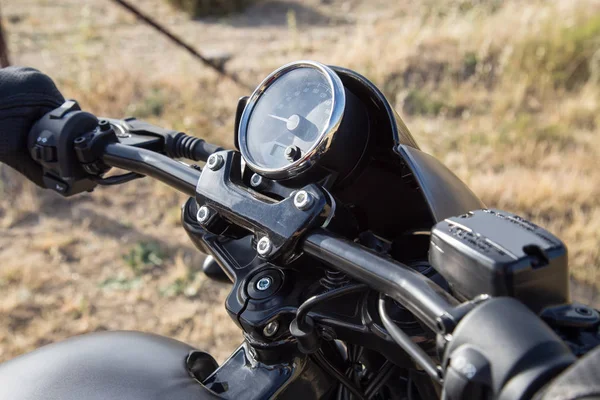 Handlebar of a motorcycle held by the biker — Stock Photo, Image
