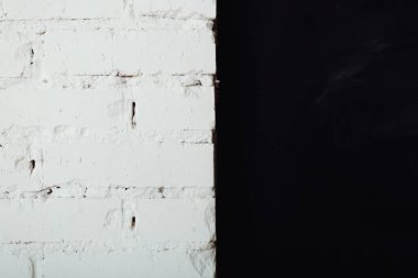 Texture of an old white and black brick wall. Abstract vintage background
