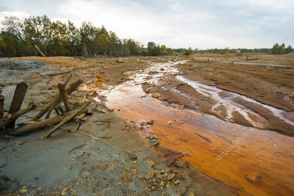 landscape with red soil polluted copper mining factory in Karabash, Russia, Chelyabinsk region