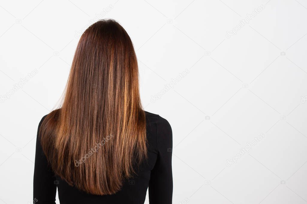 head of girl seen from the back showing fantastic long and straight hair very well-groomed