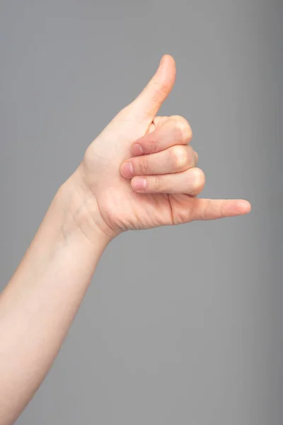 Hand Arm Caucasian Person Seen Close Isolated Grey Background Giving — Stock Photo, Image