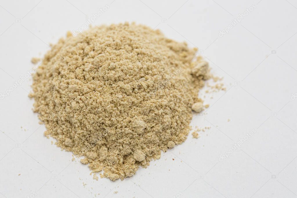 Handful of sand on white table