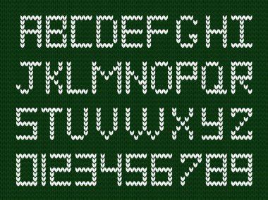Fabric script on deep green knitted background.  clipart