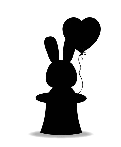 Silhouette noire de lapin avec ballon coeur en cylindre magique — Photo