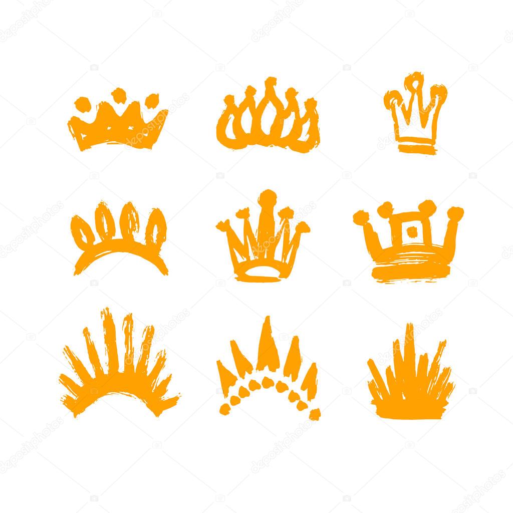 Set of crowns drawn by hand. Set texture strokes thick paint in the form of a crown isolated on white background. Grunge, sketch, graffiti. Isolated black icons, logos, symbols. Vector illustration.