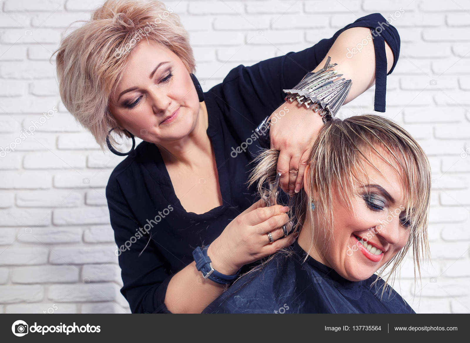 Hairdresser cut hair of woman Stock Photo by ©AlterPhoto 137735564
