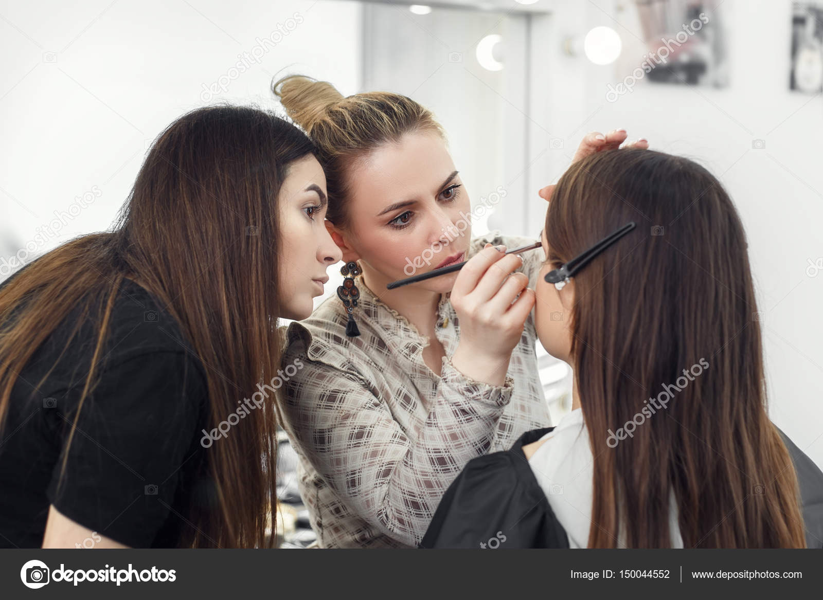 Makeup artist working in studio Stock Photo by ©AlterPhoto 150044552
