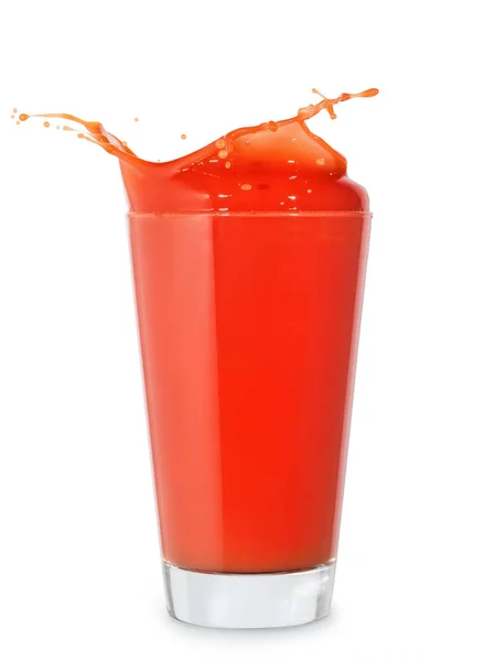 Glass of splashing tomato juice — Stock Photo, Image