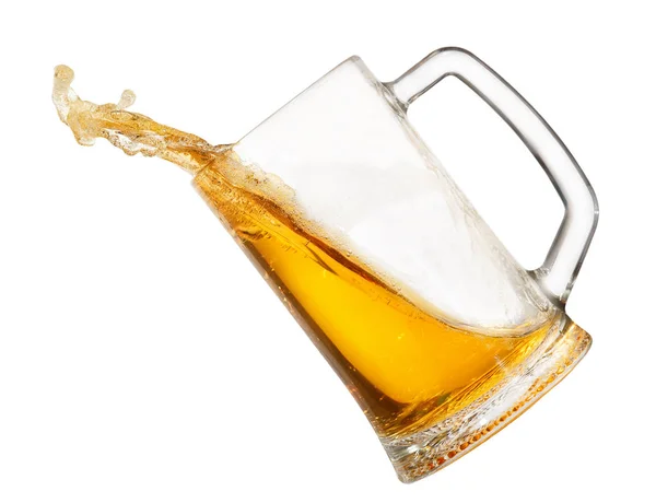 Splashing beer in mug — Stock Photo, Image