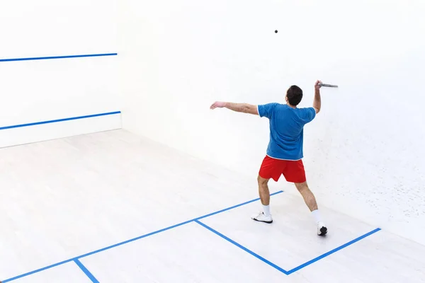 Squash player back view — Stock Photo, Image