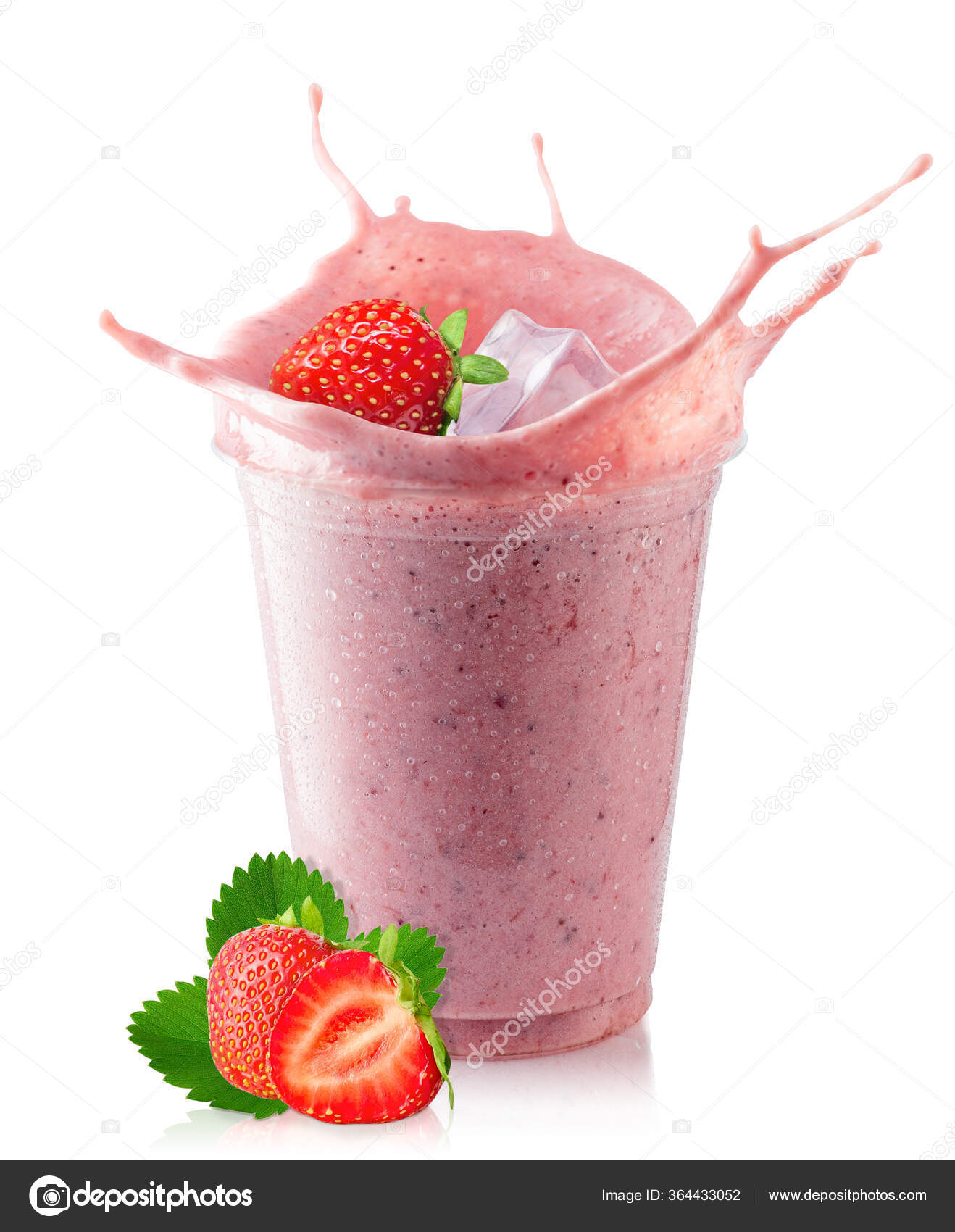 Plastic cup of milkshake with strawberries isolated on white Stock Photo by  ©belchonock 76818941