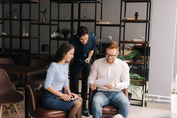 Business team coworkers talking at work, discussing new project ideas