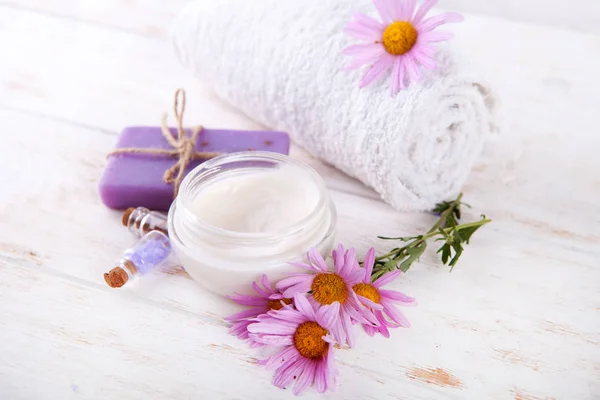 Composition of spa treatment on wooden background.sea salt natural handmade soap flover and white towel on wooden background — Stock Photo, Image